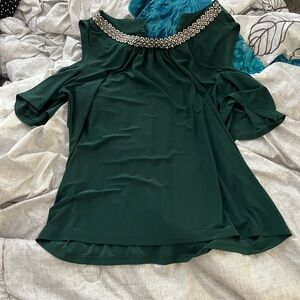 green off shoulder top with rhinestones and gems